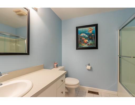 833 Edgell Road Framingham, MA 01701 - Photo 12 of 24 a bathroom with a toilet a sink and mirror