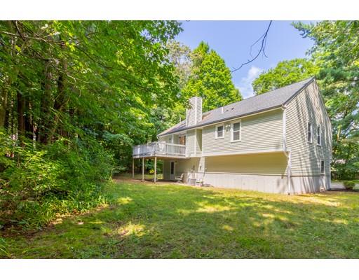833 Edgell Road Framingham, MA 01701 - Photo 22 of 24 a backyard of a house with table and chairs