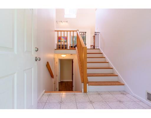 833 Edgell Road Framingham, MA 01701 - Photo 4 of 24 a view of entryway and hall with wooden floor