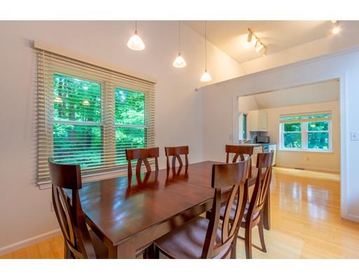 833 Edgell Road Framingham, MA 01701 - Photo 8 of 24 a view of a dining room with furniture and wooden floor