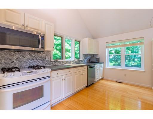 833 Edgell Road Framingham, MA 01701 - Photo 9 of 24 a kitchen with a stove a sink and a microwave
