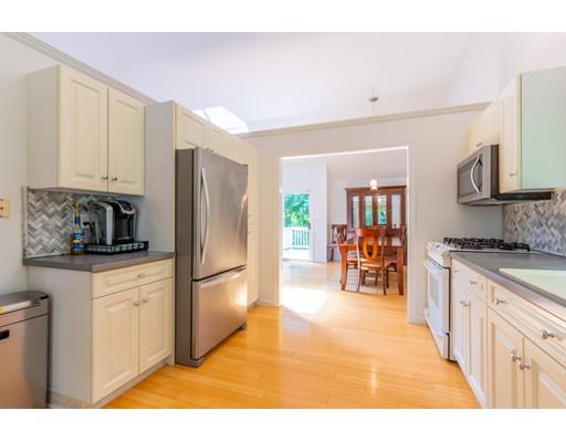 833 Edgell Road Framingham, MA 01701 - Photo 10 of 24 a kitchen with stainless steel appliances granite countertop a refrigerator and a stove top oven