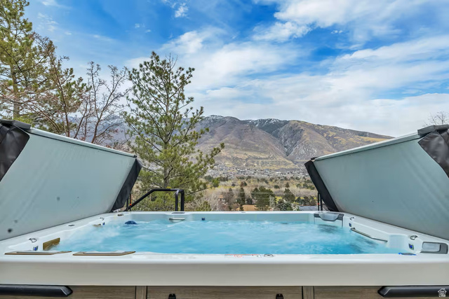 11789 Nicklaus Road Sandy, UT 84092 - Photo 55 of 58 Exterior view of mountains and a jacuzzi