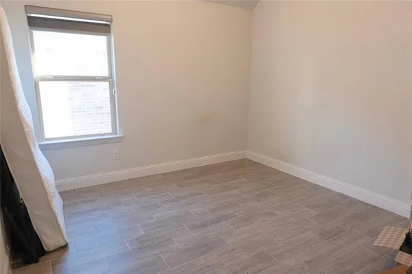 a view of hallway with wooden floor