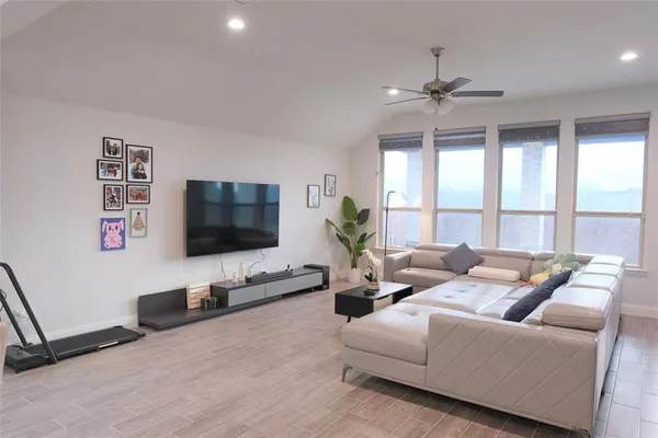 a kitchen with lots of counter space appliances and a dining table