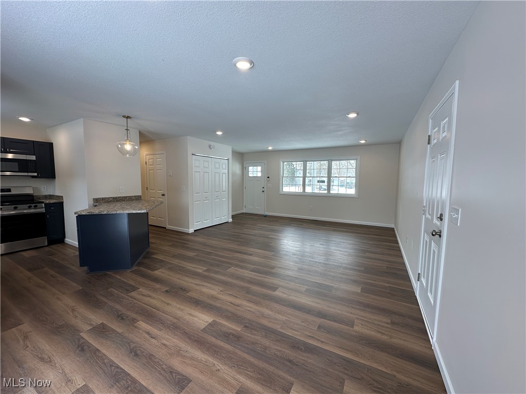 1275 South Meridian Road Youngstown, OH 44511 - Photo 15 of 16 Living room with open floor plan, wood-style floors, and recessed lighting