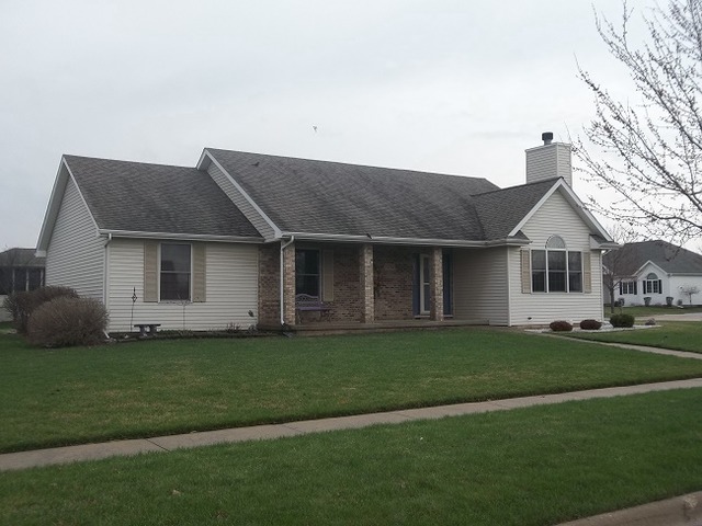 1232 Pickwick Drive Rochelle, IL 61068 - Photo 2 of 16 a front view of a house with a garden