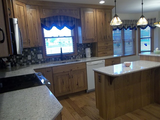 1232 Pickwick Drive Rochelle, IL 61068 - Photo 12 of 16 a kitchen with sink cabinets and a large window