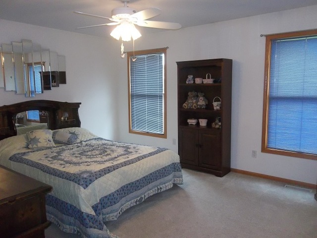 1232 Pickwick Drive Rochelle, IL 61068 - Photo 14 of 16 a bedroom with a bed and a window