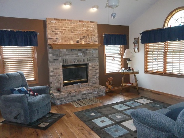 1232 Pickwick Drive Rochelle, IL 61068 - Photo 3 of 16 a living room with furniture and a fireplace