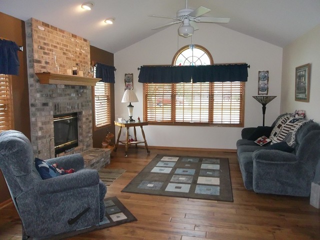 1232 Pickwick Drive Rochelle, IL 61068 - Photo 4 of 16 a living room with furniture and a fireplace