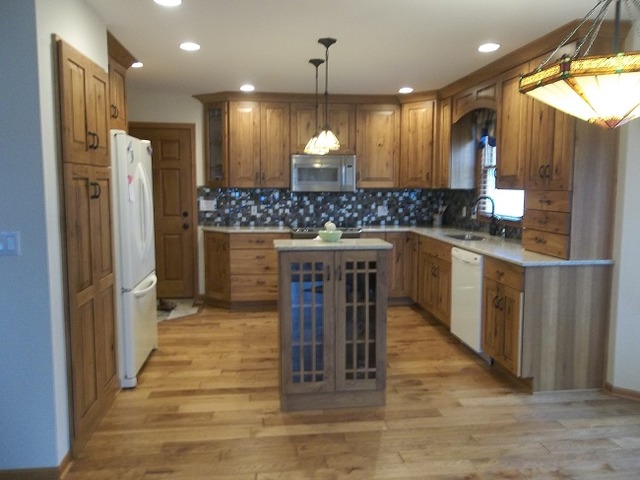 1232 Pickwick Drive Rochelle, IL 61068 - Photo 9 of 16 a kitchen with kitchen island a counter top space a sink stainless steel appliances and cabinets