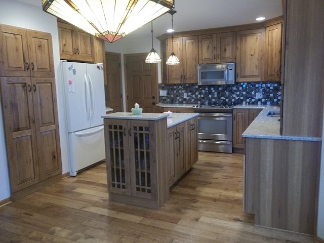 1232 Pickwick Drive Rochelle, IL 61068 - Photo 10 of 16 a kitchen with stainless steel appliances a refrigerator and a wooden cabinets