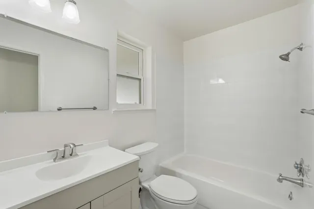 a bathroom with a sink toilet and bathtub