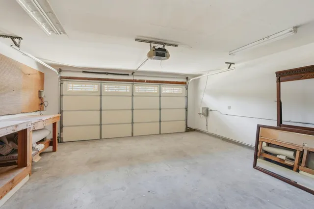 a view of a livingroom with furniture and a ceiling fan