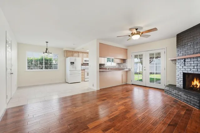 a view of a kitchen with furniture wooden floor and a kitchen