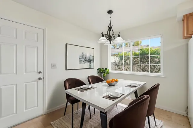a view of a dining room with furniture window and outside view