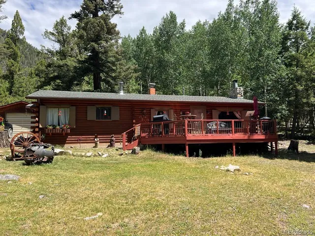 a view of a house with a yard porch and sitting area