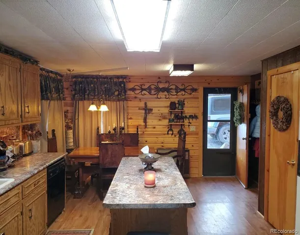 a view of a dining room with furniture and window
