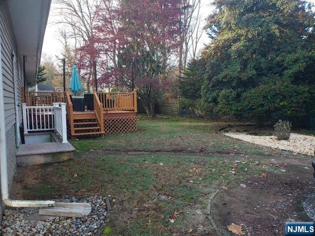 99 Knickerbocker Road Demarest, NJ 07627 - Photo 3 of 10 a view of a backyard with wooden fence