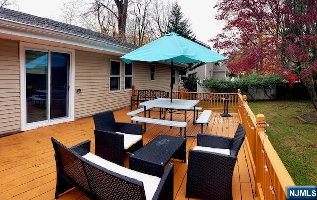 99 Knickerbocker Road Demarest, NJ 07627 - Photo 5 of 10 a outdoor space with wooden seating and barbeque oven