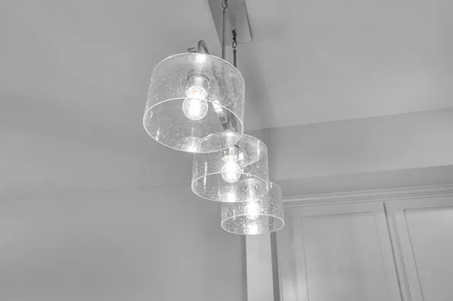 a kitchen with stainless steel appliances granite countertop a sink a stove and cabinets