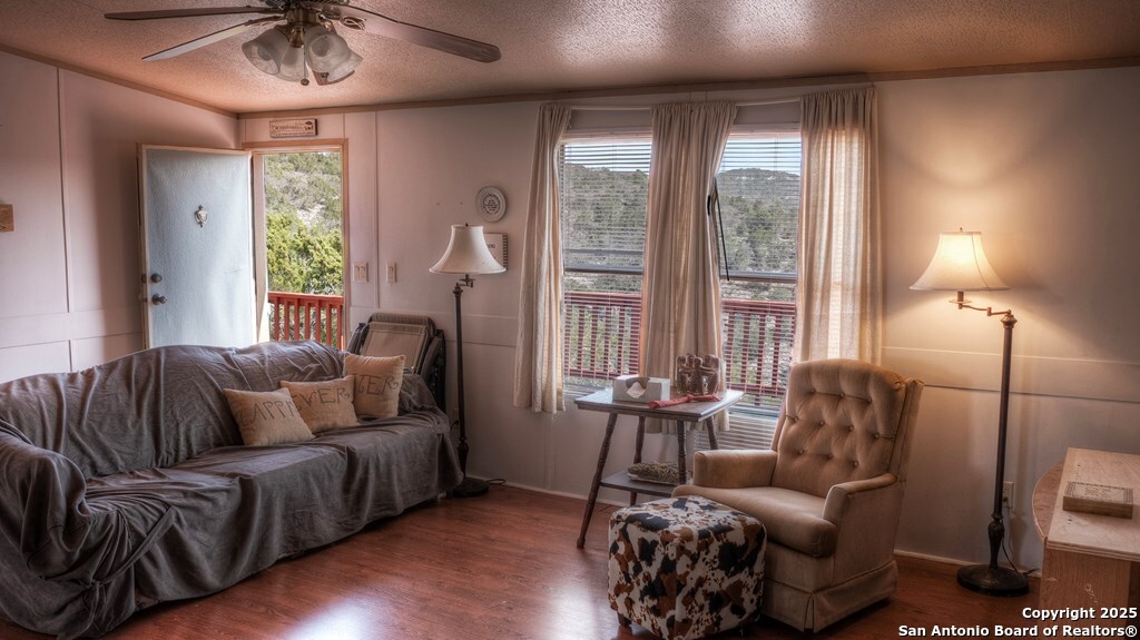 560 Pine Mountain Road Camp Wood, TX 78833 - Photo 17 of 38 a living room with furniture and a large window