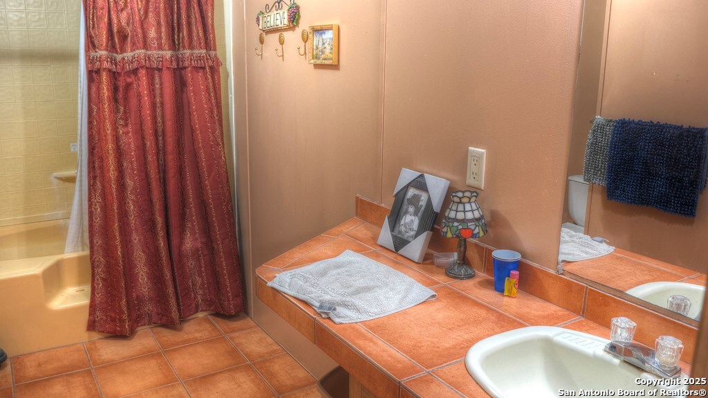 560 Pine Mountain Road Camp Wood, TX 78833 - Photo 23 of 38 a bathroom with a sink and a mirror