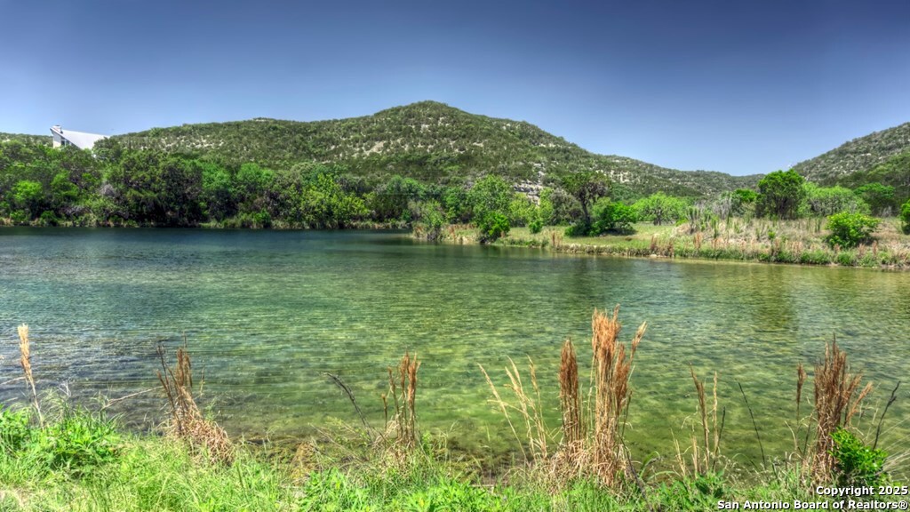 560 Pine Mountain Road Camp Wood, TX 78833 - Photo 29 of 38 a view of a lake with a mountain in the background