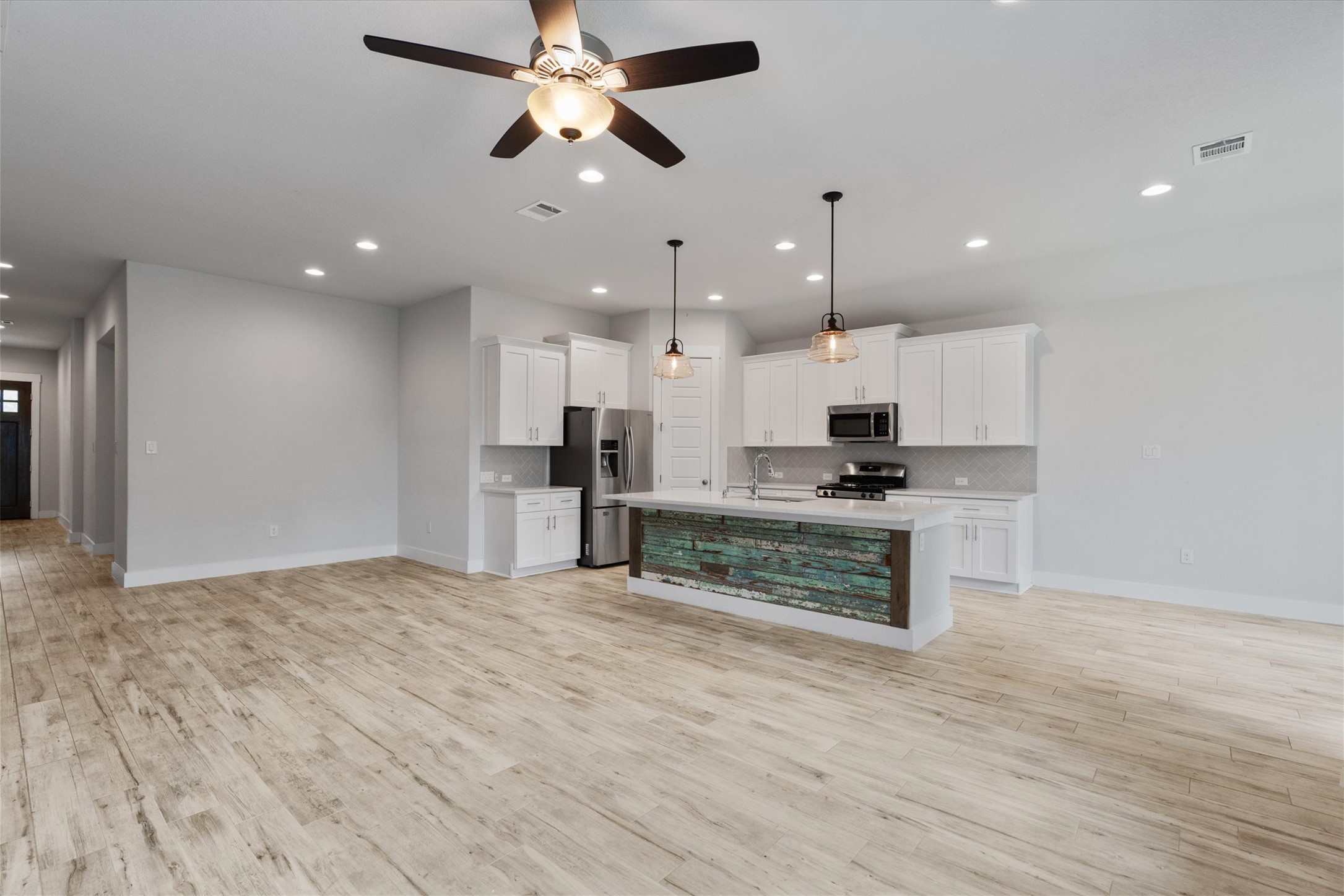 941 Del Raphael Drive Leander, TX 78641 - Photo 5 of 31 This layout is built for real life; you can easily chat with someone at the kitchen island without leaving the couch