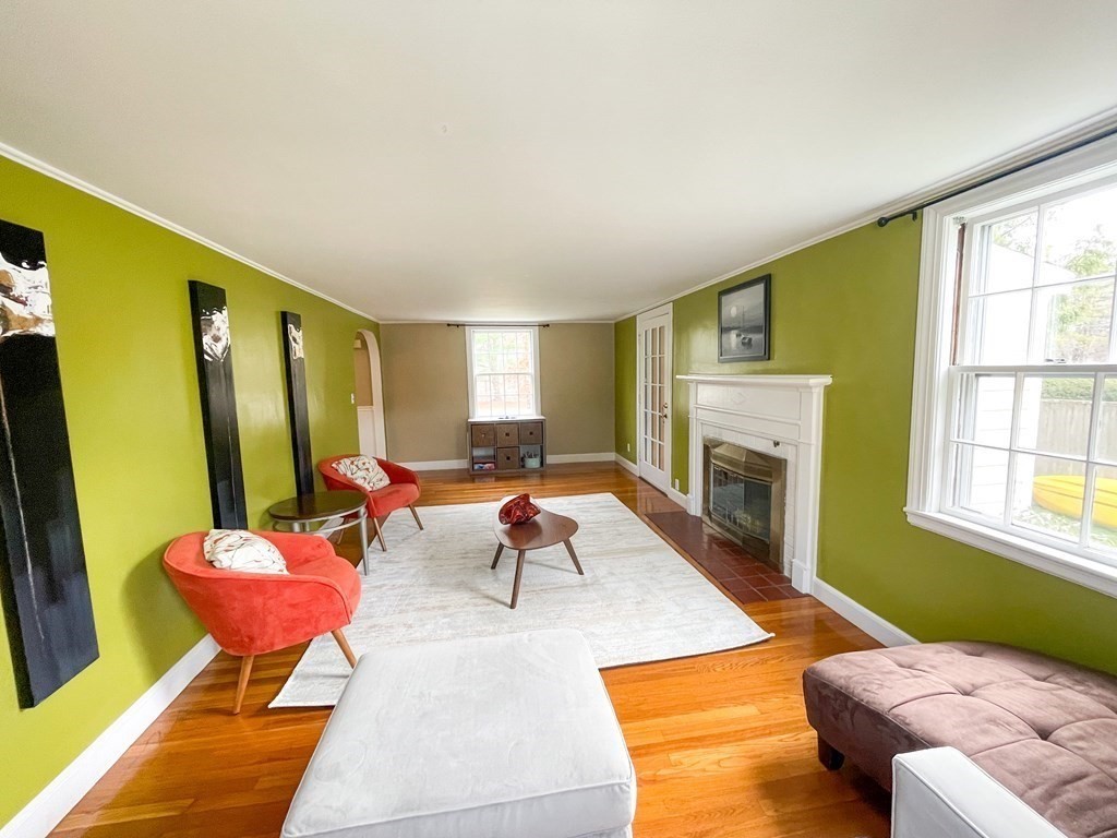 526 Quinobequin Road Newton, MA 02468 - Photo 12 of 42 a living room with furniture fireplace and window