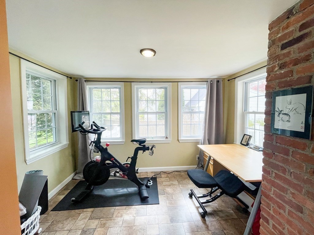 526 Quinobequin Road Newton, MA 02468 - Photo 15 of 42 a view of a livingroom with workspace and a window