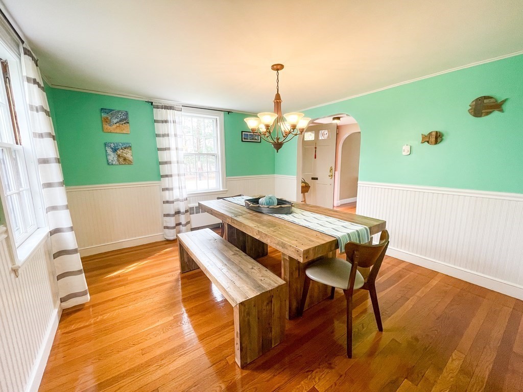 526 Quinobequin Road Newton, MA 02468 - Photo 17 of 42 a dining room with a table and chairs