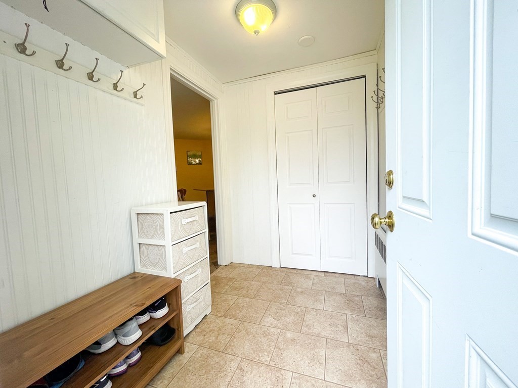 526 Quinobequin Road Newton, MA 02468 - Photo 19 of 42 a view of room with furniture and wooden floor