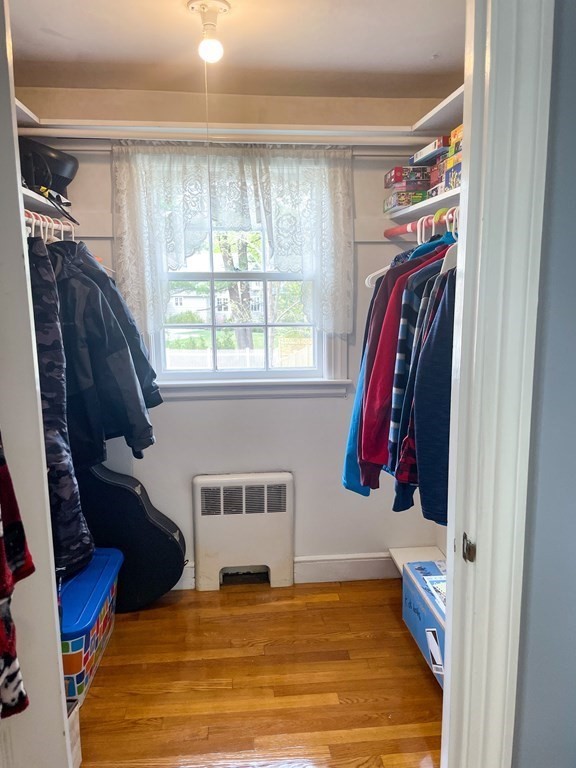 526 Quinobequin Road Newton, MA 02468 - Photo 29 of 42 a view of walk in closet with clothes and shoes