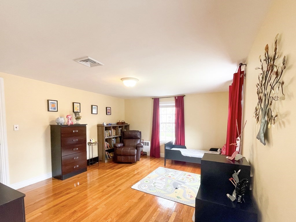 526 Quinobequin Road Newton, MA 02468 - Photo 31 of 42 a living room with furniture and a flat screen tv