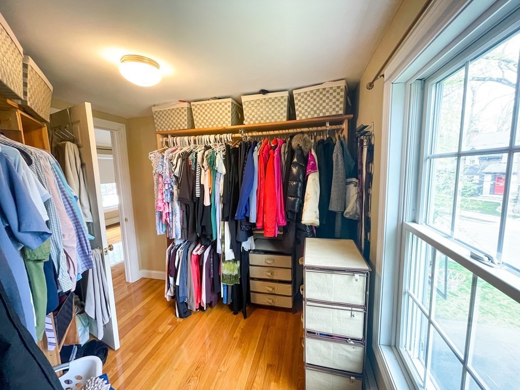 526 Quinobequin Road Newton, MA 02468 - Photo 34 of 42 a view of walk in closet with clothes and shoes