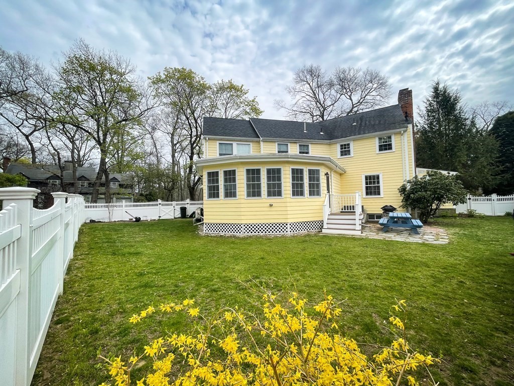 526 Quinobequin Road Newton, MA 02468 - Photo 8 of 42 a view of a house with a yard patio and swimming pool