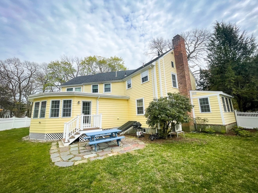 526 Quinobequin Road Newton, MA 02468 - Photo 9 of 42 a view of a house with backyard sitting area and garden