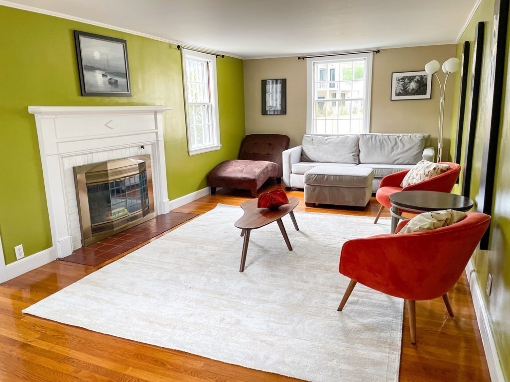 526 Quinobequin Road Newton, MA 02468 - Photo 10 of 42 a living room with furniture and a fireplace