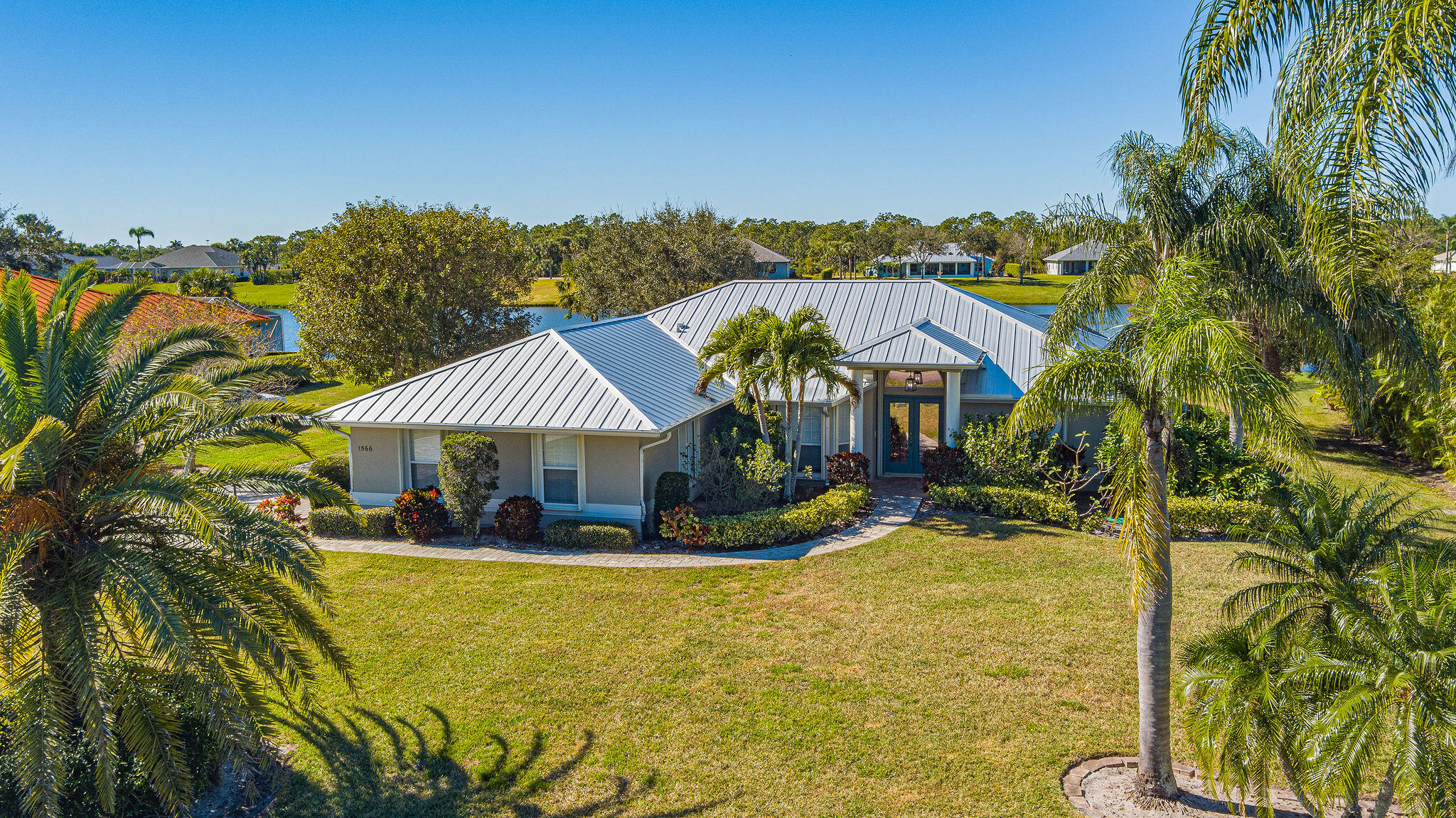 1566 Eagles Circle Sebastian, FL 32958 - Photo 12 of 74 a view of a house with swimming pool and porch with furniture
