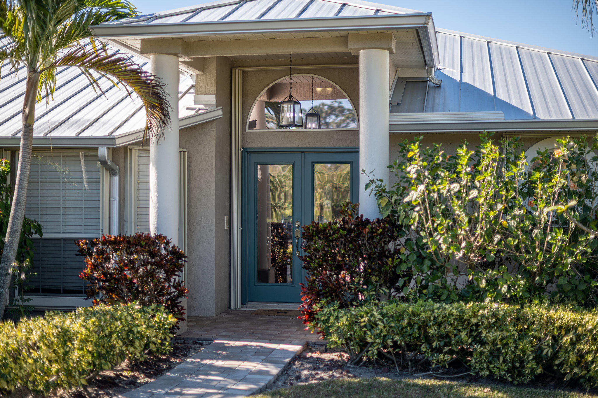 1566 Eagles Circle Sebastian, FL 32958 - Photo 13 of 74 a front view of a house with lots of yellow lighting