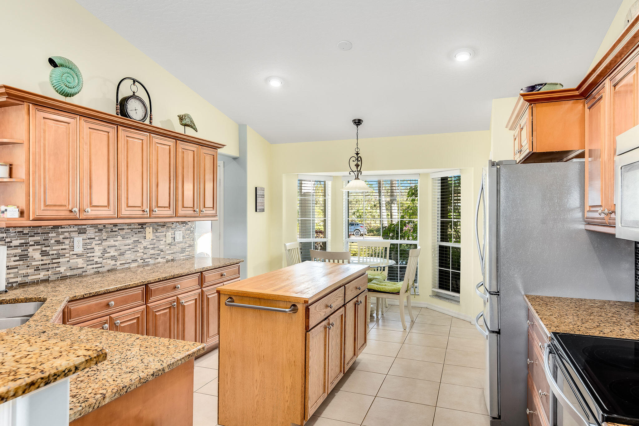 1566 Eagles Circle Sebastian, FL 32958 - Photo 19 of 74 a kitchen with a sink stove and cabinets