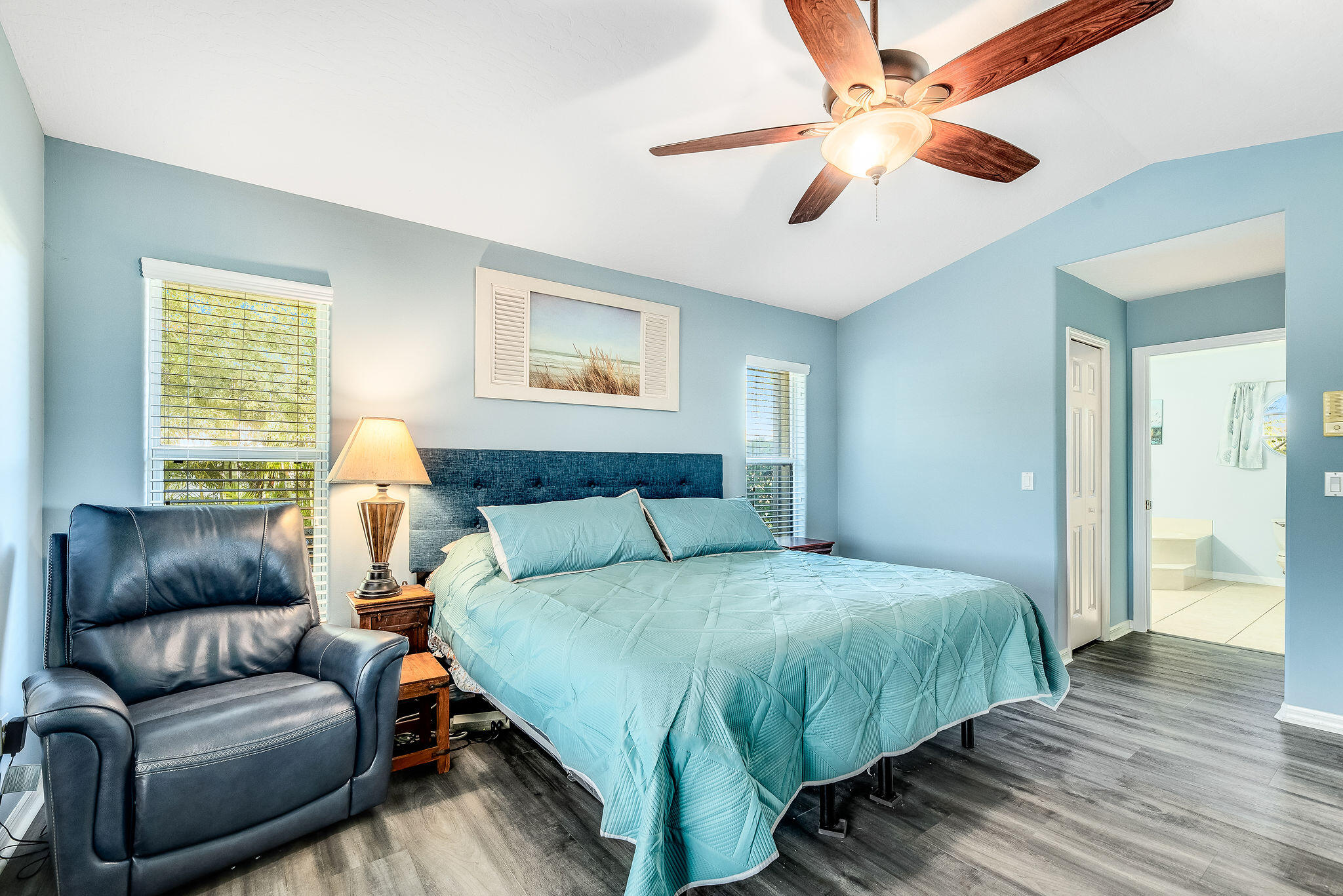 1566 Eagles Circle Sebastian, FL 32958 - Photo 25 of 74 a bedroom with a bed couch and window