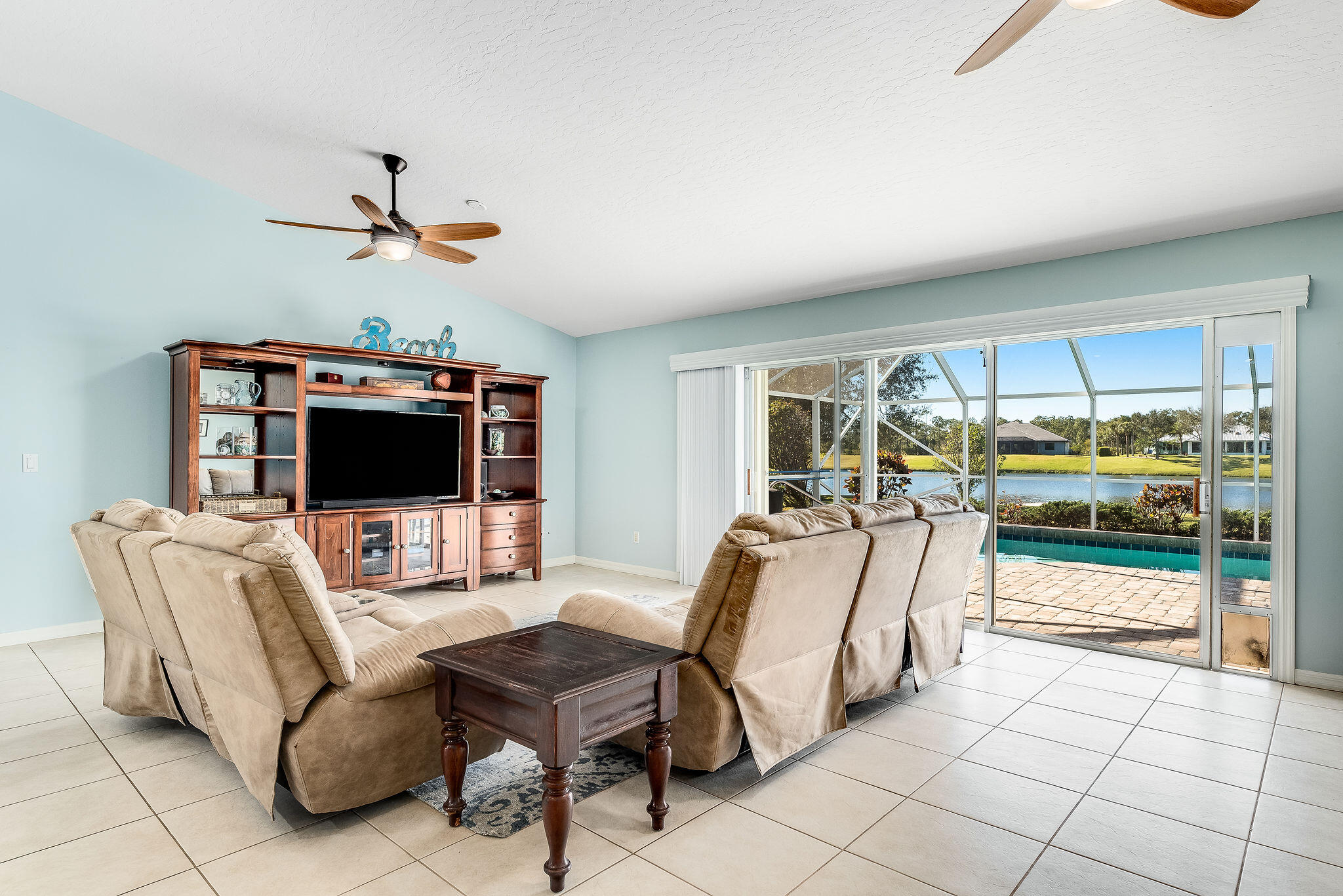 1566 Eagles Circle Sebastian, FL 32958 - Photo 30 of 74 a living room with furniture and a flat screen tv