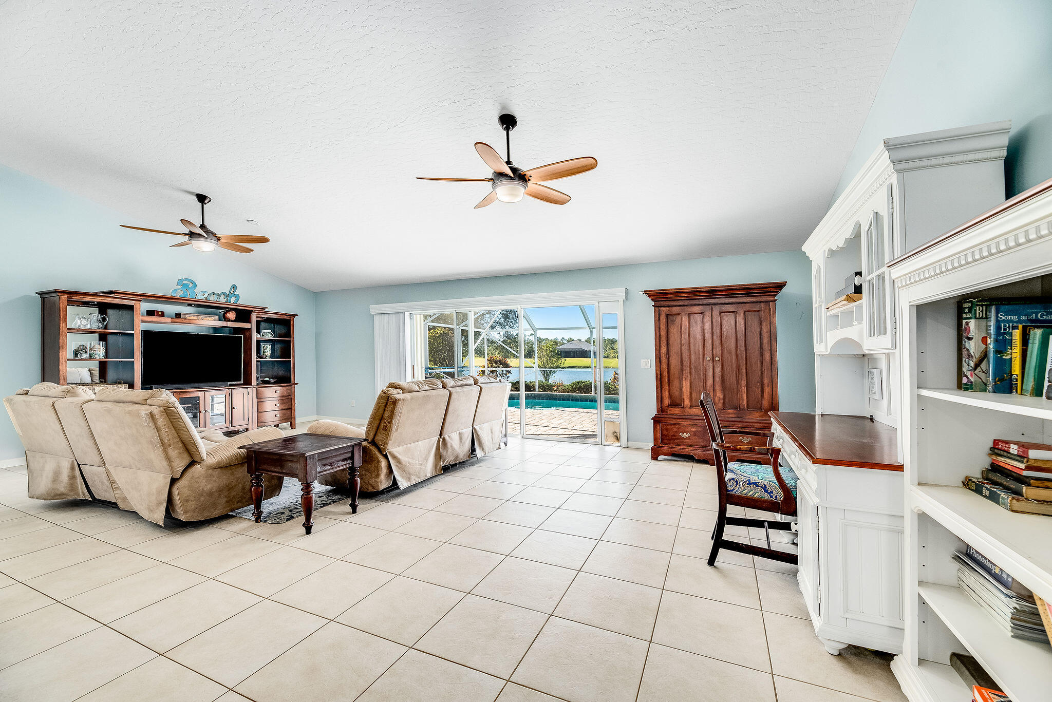 1566 Eagles Circle Sebastian, FL 32958 - Photo 31 of 74 a living room with furniture and a flat screen tv