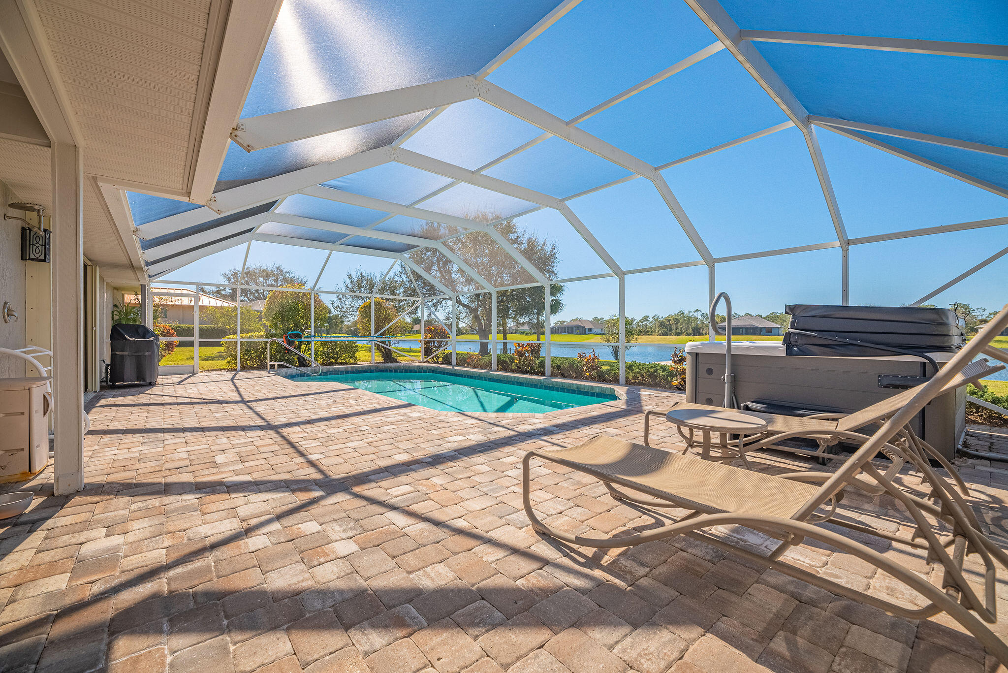 1566 Eagles Circle Sebastian, FL 32958 - Photo 39 of 74 a view of a patio with a table and chairs under an umbrella