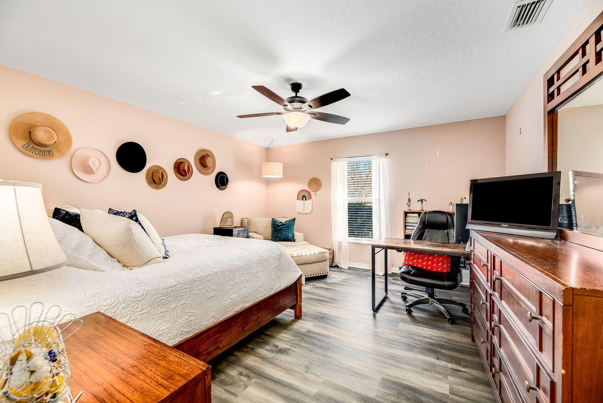 1566 Eagles Circle Sebastian, FL 32958 - Photo 51 of 74 a bedroom with a bed and a flat screen tv