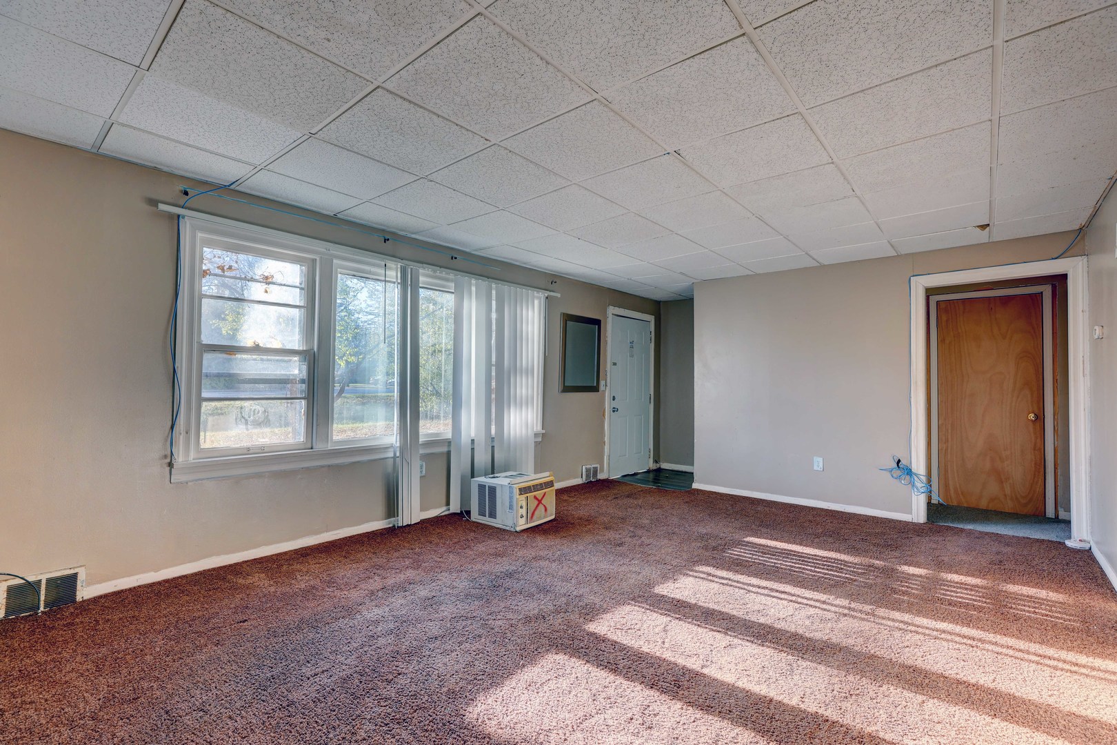1025 North Rand Road Prospect Heights, IL 60070 - Photo 3 of 16 a view of an empty room with a window