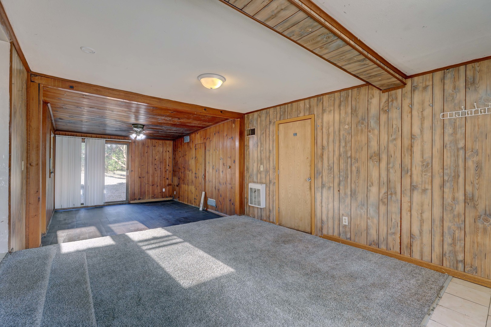 1025 North Rand Road Prospect Heights, IL 60070 - Photo 6 of 16 a view of a hallway with wooden walls